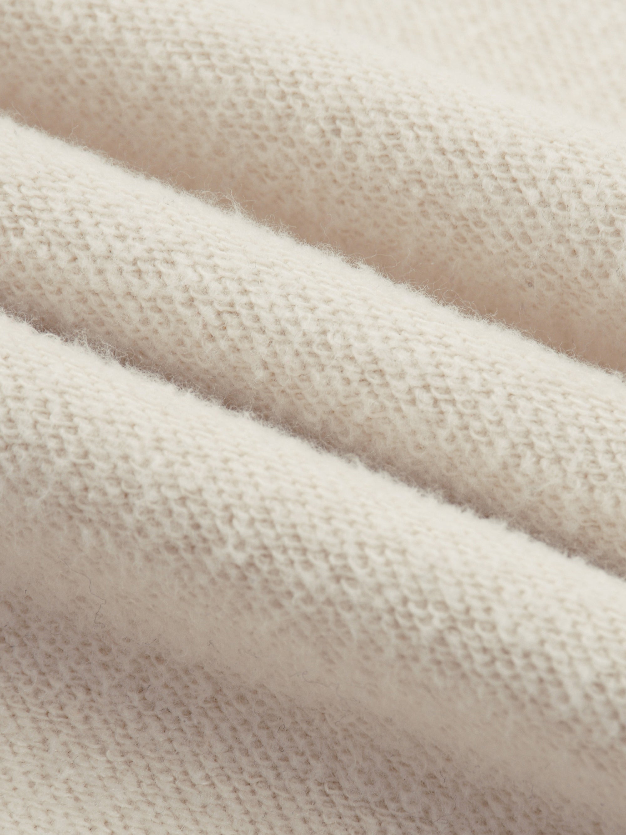 Detailed close-up of Genzerz knit fabric texture emphasizing durability and comfort.