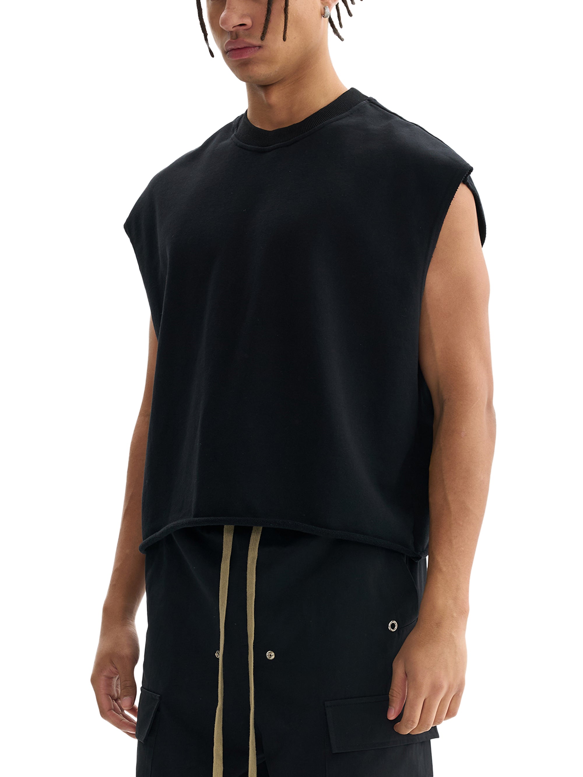 Model in Genzerz Z Lightning Tank – angled pose showing oversized sleeveless fit
