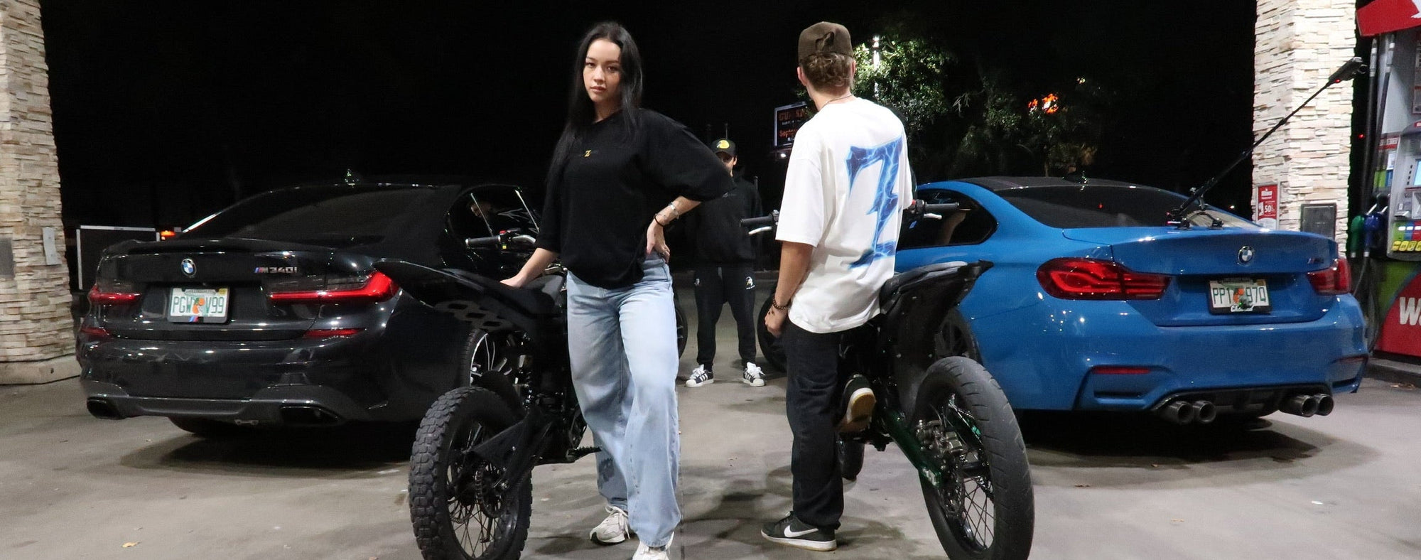 Lifestyle shot featuring the Genzerz Co. crew at a night gas station meet. E-bikes, cars, and streetwear collide — built for motion, designed for presence.