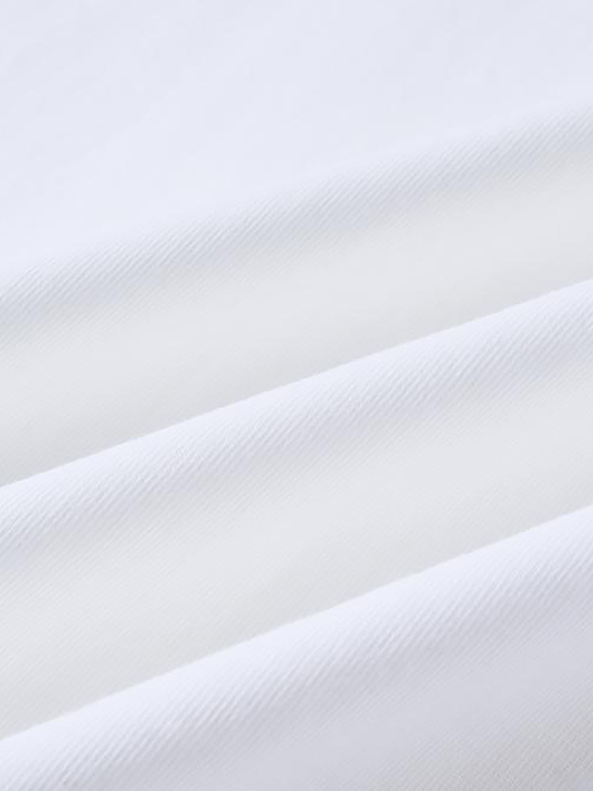 Genzerz t-shirt close-up of wrinkled white fabric with a subtle texture