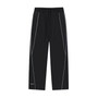 Front view of black Genzerz wide-leg track pants with white piping detail on a white background.