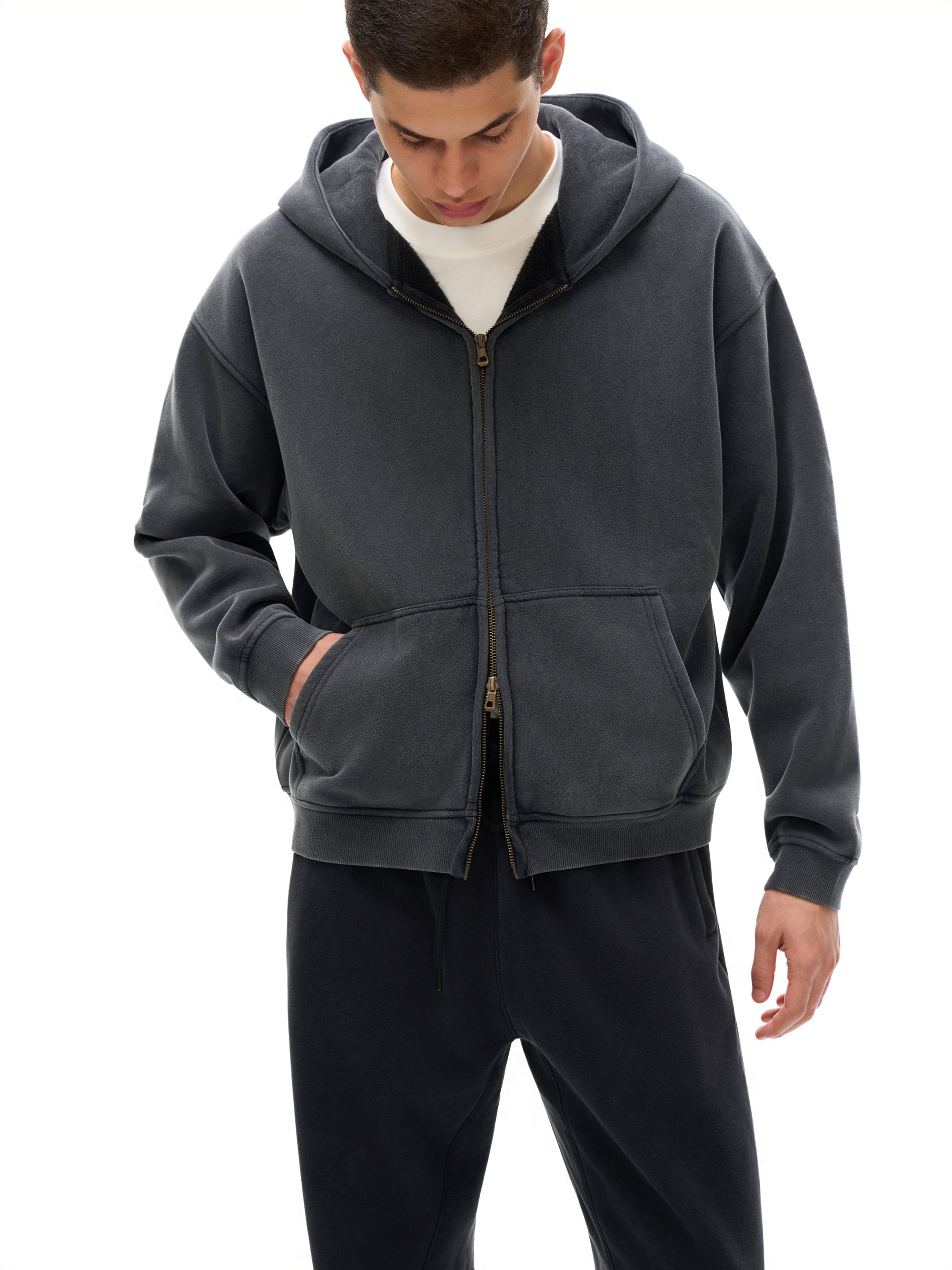Model wearing Genzerz Boxy Zip-Up Hoodie – vintage washed black oversized hoodie