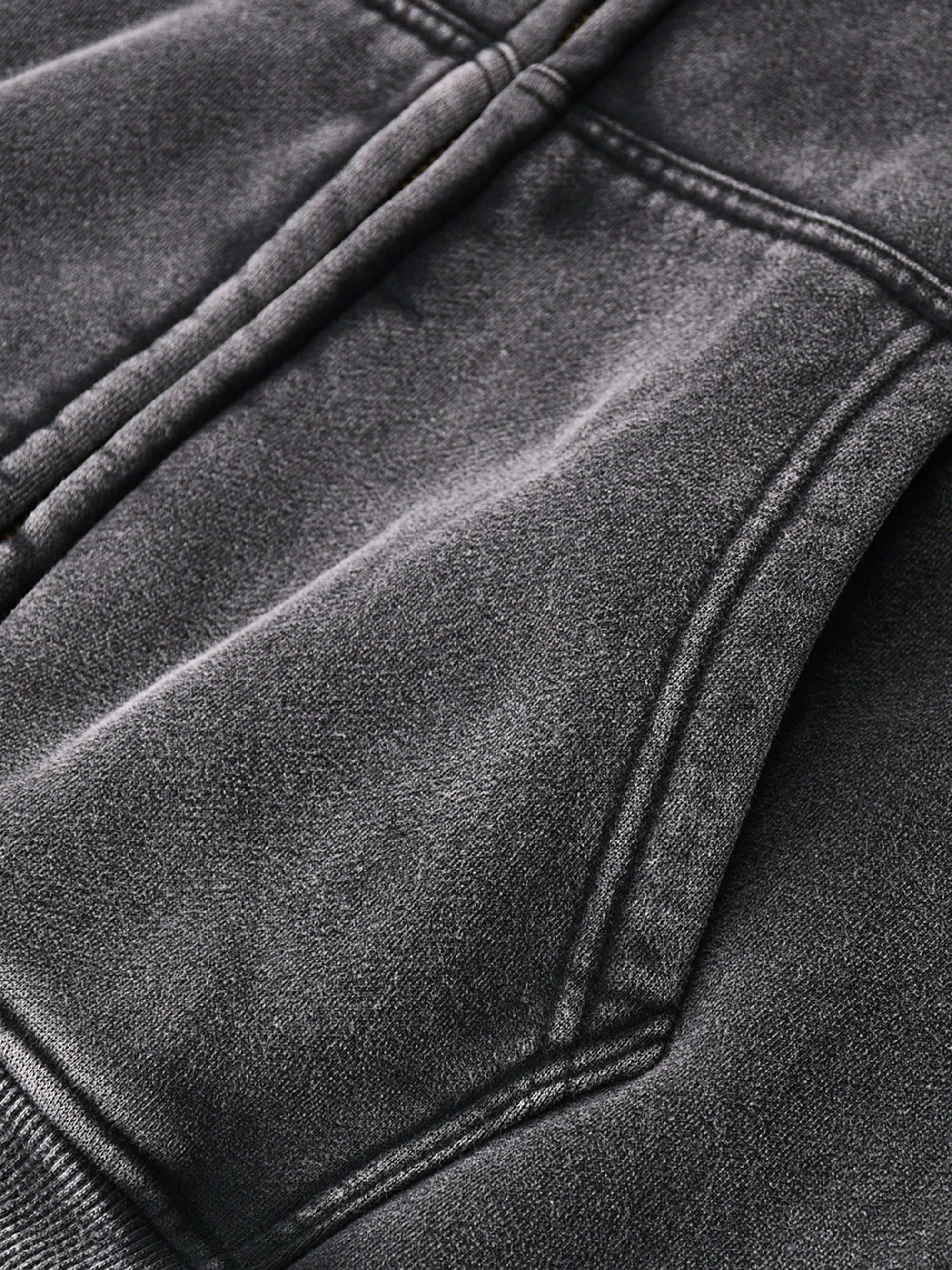 Front pocket detail of Genzerz Boxy Zip-Up Hoodie – vintage washed black