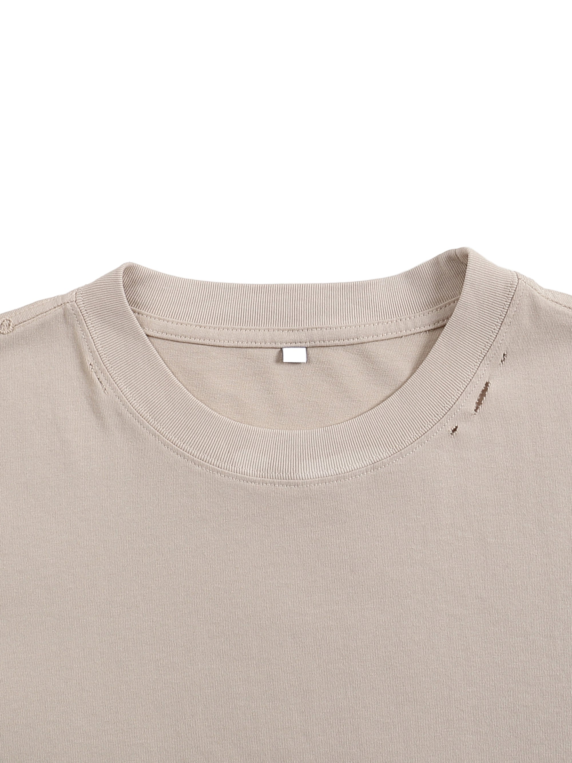 Close-up of Genzerz distressed tee collar showing subtle tear design, clean stitching, and premium cotton fabric texture.